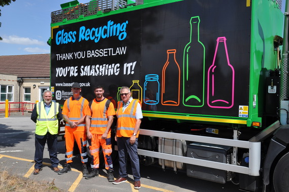 Bassetlaw District Council waste management staff and Cllr Darrell Pulk beside branded refuse collection vehicle.