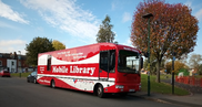 Photograph of the modern mobile library van (a big red bus!)