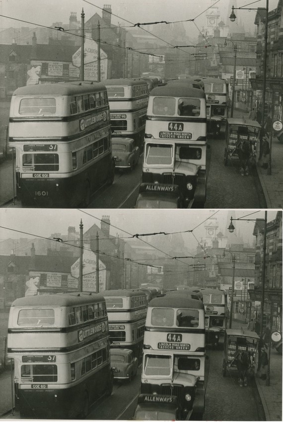 Black & white photo of a very congested Digbeth High Street, full of buses, looking towards Smithfield Street, Birmingham, in 1953.