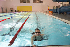 woman lane swimming in pool