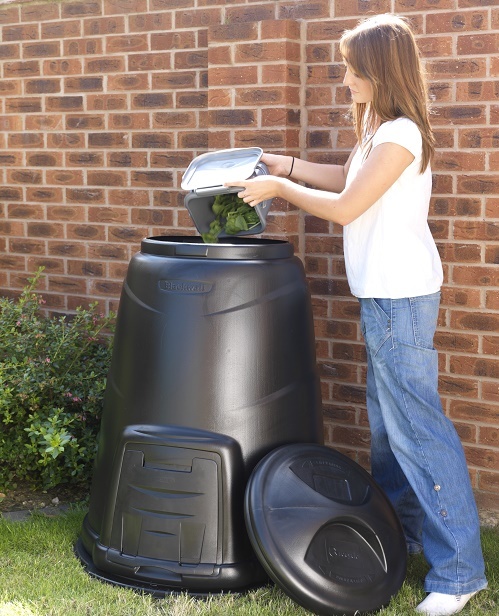 Black compost bin being filled