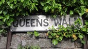 Road sign reading: Queens Walk