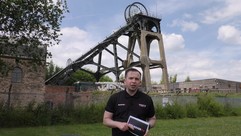 Michael standing in front of Pleasley Pit headstocks