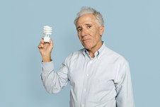 Man holding eco lightbulb