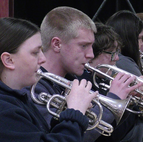 people playing brass instruments