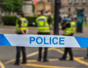Police behind police tape