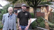 Tom and Ben standing next to the sculpture