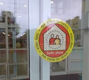 A safe places sticker attached to a window