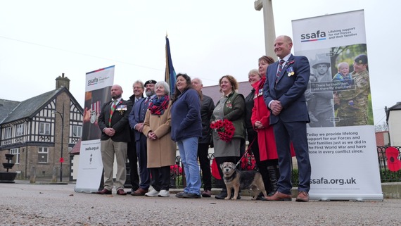 Group of people gathered around Bolsover cenotaph