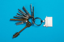 Large bunch of different keys on a blue background