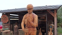 Wooden sculpture of a world war one soldier