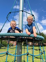 Two boys on play equipment