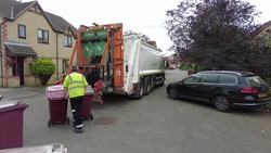 burgundy bins being collected