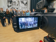 Group of school children shown through a video camera lens