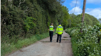Rangers walking on a path