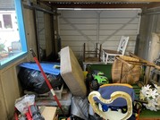 The inside of a garage with a large number of items