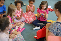 A group of children playing with musical instruments
