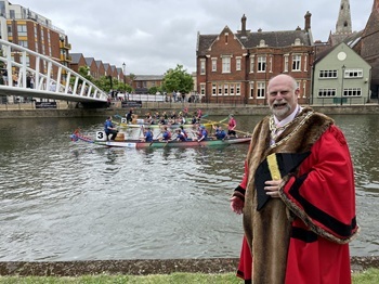 Mayor Tom Wootton at the River Festival - Dragonboat in background