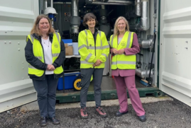 Gillian Martin stands to the right, with BGS' Alison Monaghan to the left and Vanessa Starcher in the middle. All are wearing PPE. 