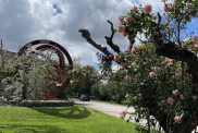 Cherry blossoms next to a armillary sphere sculpture at the ESA near Rome.