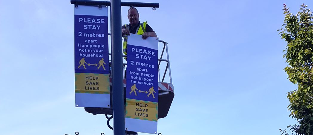 Putting up lamp post banners