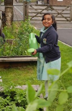 Edible playground girl with watering can