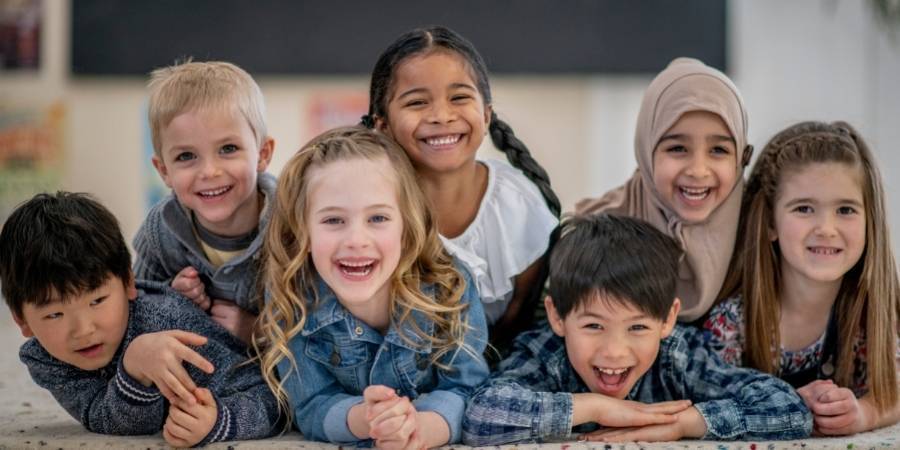 Photograph of a group of young children smiling