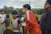 Photograph of young people outside on a field