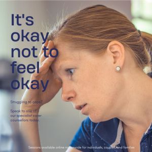 Photo of a woman with her hand on her head looking down