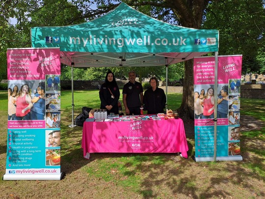 Photograph of the Living Well Team and gazebo