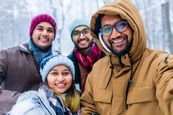 Group of people wrapped up in warm coats outside