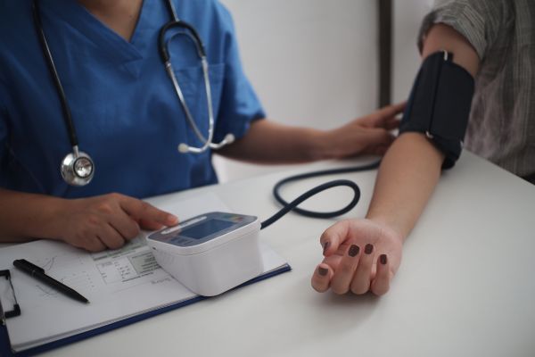 Photograph of someone having a blood pressure check