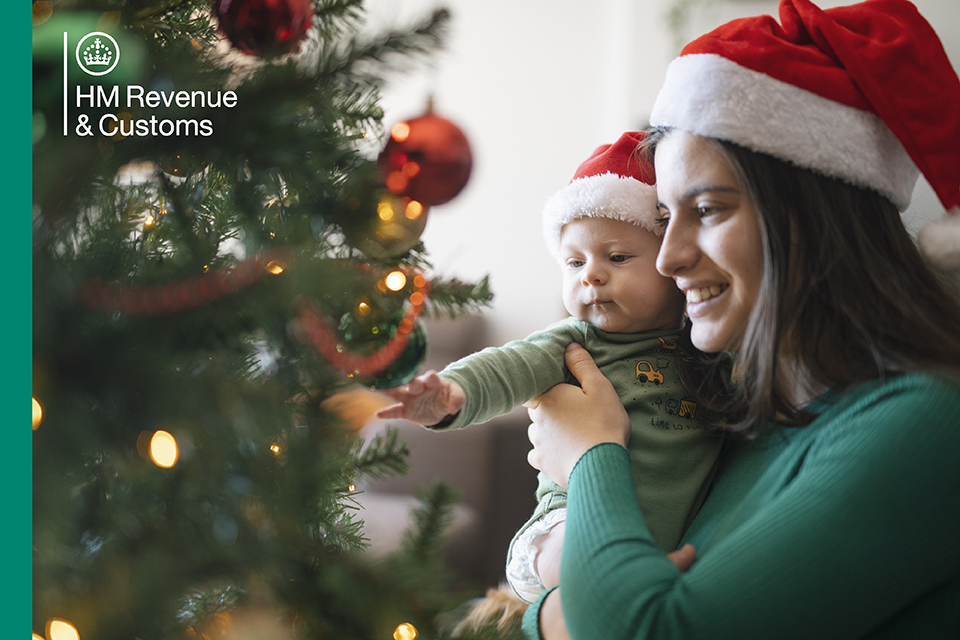HM Revenue and Customs - image of baby and mum in a Christmas scene