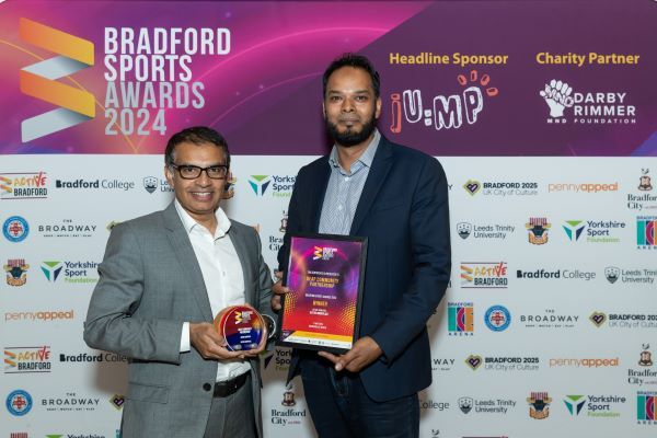 Photograph of two award winners smiling into the camera