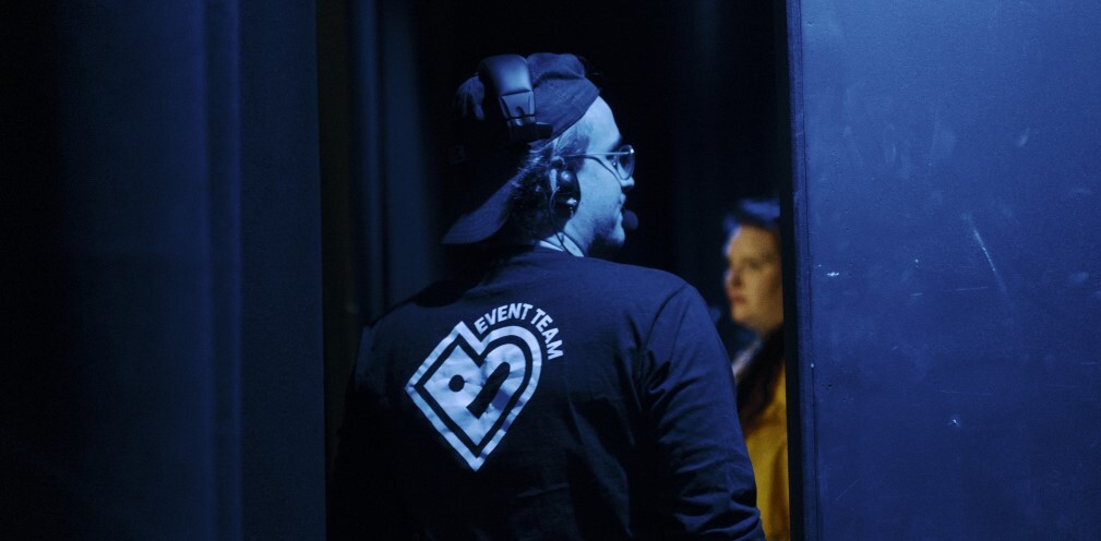 A man walking through a door