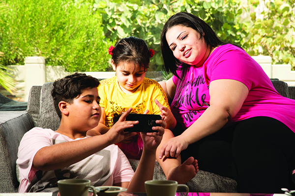 Photograph of a family relaxing at home