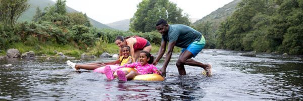 Photo of a family enjoying playing in the water