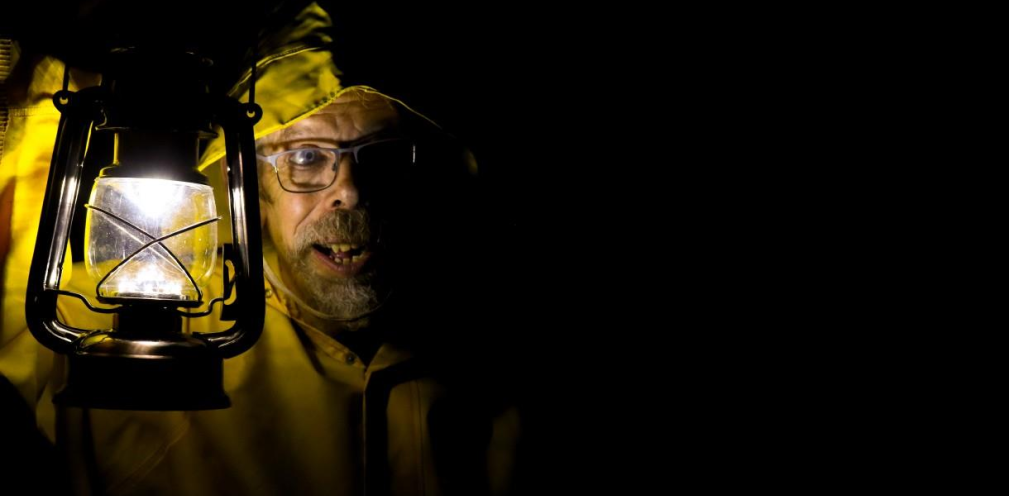 A man holding a lantern