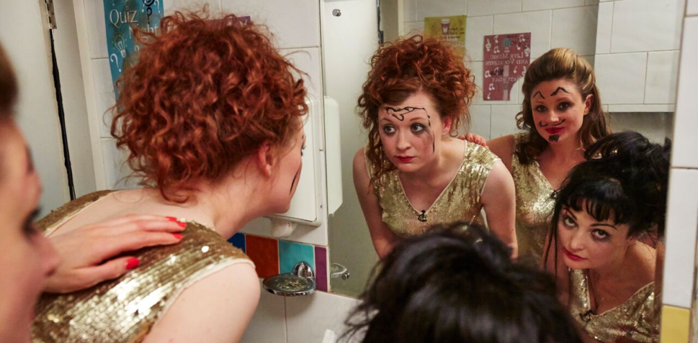 People looking in a mirror