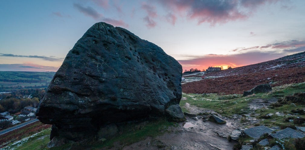 A rock formation against a sunrise