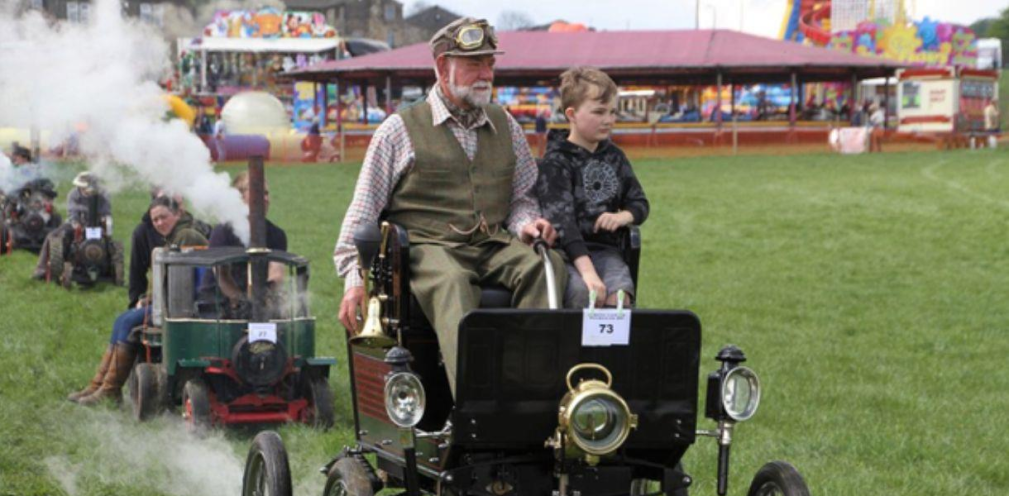 A man driving a vintage car