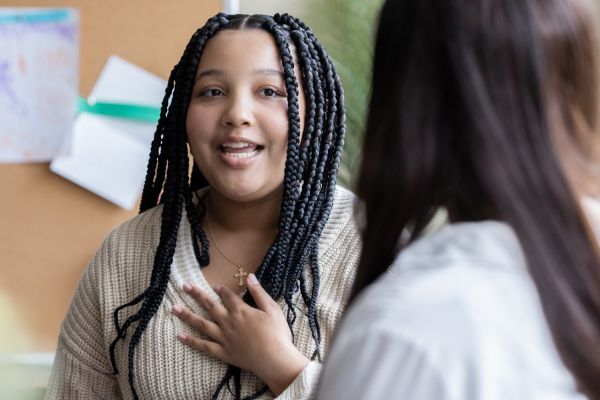 Young person talking to an adult