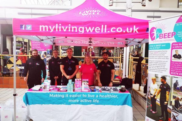 The Living Well Team at an event in a shopping centre