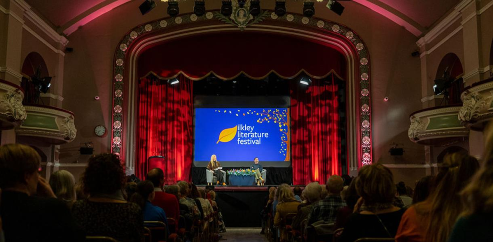 An audience watching a stage