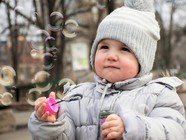 Winter, child and bubbles