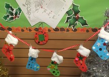 Christmas stocking decorations produced using a library craft pack for children
