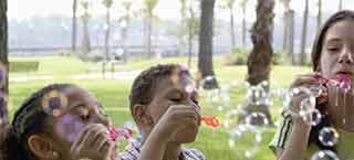 children blowing bubbles