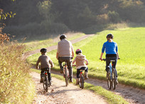 Family out cycling in the countryside