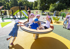 Children enjoying new playground equipment