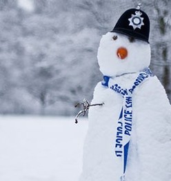 Snowman with a Police Hat on